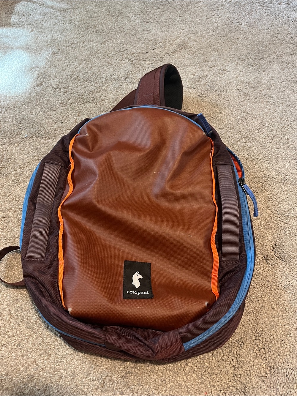 cotopaxi Brown Backpack with Orange Piping and Blue Zipper